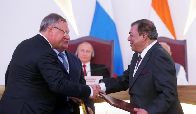 Andrei Kostin, chief executive of Russia's bank VTB, Igor Sechin, chief executive of Russia's top oil producer Rosneft, and Ravi Ruia, vice chairman of Essar Group, (REUTERS) Andrei Kostin, chief executive of Russia's bank VTB, Igor Sechin, chief executive of Russia's top oil producer Rosneft, and Ravi Ruia, vice chairman of Essar Group, (REUTERS)