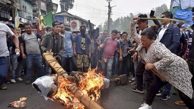GJM supporters burn an effigy of West Bengal Chief Minister Mamata Banerjee at Chowk Bazaar during their indefinite bandh in Darjeeling on Monday. (PTI) GJM supporters burn an effigy of West Bengal Chief Minister Mamata Banerjee at Chowk Bazaar during their indefinite bandh in Darjeeling on Monday. (PTI)