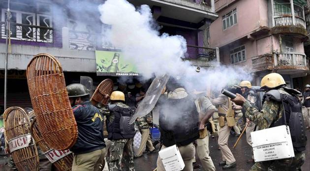 Security personnel fire teargas shells during a protest by GJM activists in Darjeeling.(PTI file photo)