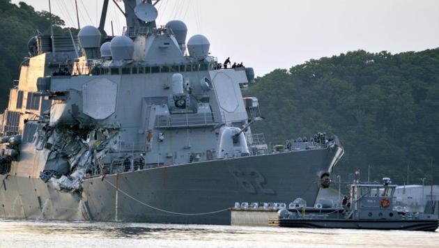 In this Saturday, June 17, 2017 photo, released by the US Navy, the damaged USS Fitzgerald is towed into port at the US Naval base in Yokosuka, southwest of Tokyo, Japan, after the Navy destroyer collided with a merchant ship. (AP) In this Saturday, June 17, 2017 photo, released by the US Navy, the damaged USS Fitzgerald is towed into port at the US Naval base in Yokosuka, southwest of Tokyo, Japan, after the Navy destroyer collided with a merchant ship. (AP)