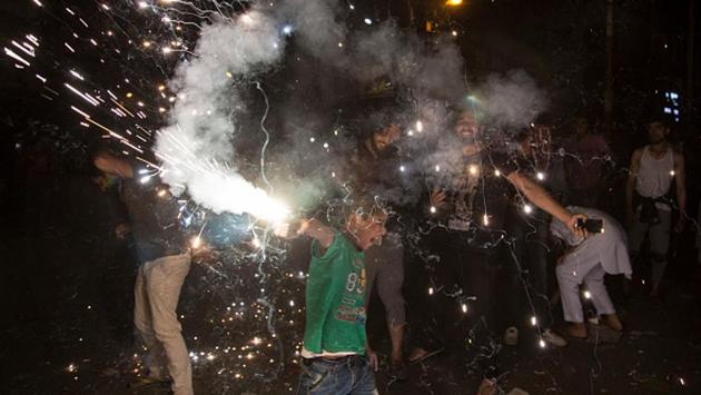 Kashmiri people celebrate after Pakistan's win in the ICC Champions Trophy final against India Sunday, in the old city of Srinagar.(NurPhoto via Getty Images)