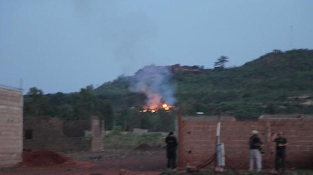 Fire can be seen by the swimming pool of the Campement Kangaba, a tourist resort near Bamako, Mali. (AP) Fire can be seen by the swimming pool of the Campement Kangaba, a tourist resort near Bamako, Mali. (AP)