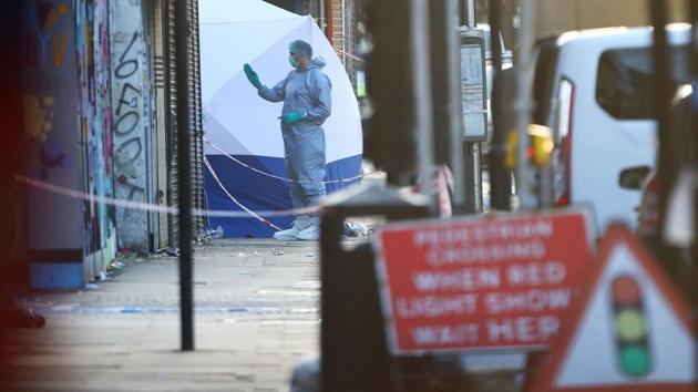 A forensic officer attends to the investigation scene of the vehicle collision. (REUTERS) A forensic officer attends to the investigation scene of the vehicle collision. (REUTERS)