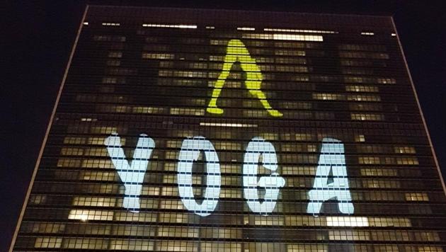 United Nations Building in New York lit up with Yoga symbol, on June 19, 2017, ahead of International Day of Yoga.(IANS)