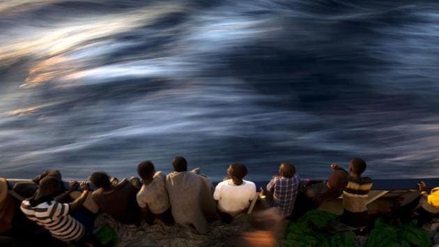 Migrants and refugees stand on the deck of the vessel Golfo Azzurro after being rescued by Spanish NGO Proactiva Open Arms workers on the Mediterranean Sea, Friday, June 16, 2017. A Spanish aid organization Thursday rescued more than 600 migrants who were attempting the perilous crossing of the Mediterranean Sea to Europe in packed boats from Libya. (AP) Migrants and refugees stand on the deck of the vessel Golfo Azzurro after being rescued by Spanish NGO Proactiva Open Arms workers on the Mediterranean Sea, Friday, June 16, 2017. A Spanish aid organization Thursday rescued more than 600 migrants who were attempting the perilous crossing of the Mediterranean Sea to Europe in packed boats from Libya. (AP)
