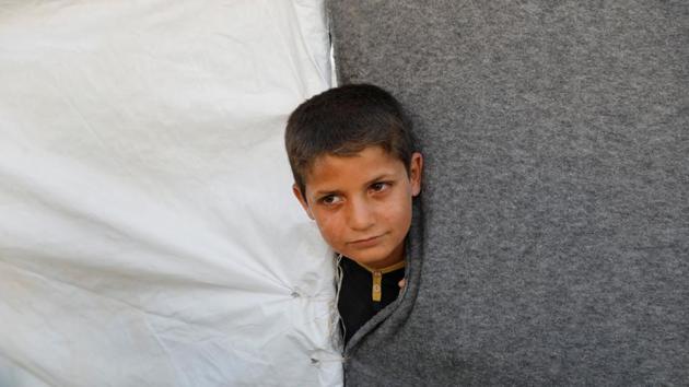 An evacuee looks out from a tent inside a refugee camp for people who fled from Mosul due to fighting between Iraqi forces and Islamic State militants, on the outskirts of Erbil, Iraq June 10, 2017. (REUTERS) An evacuee looks out from a tent inside a refugee camp for people who fled from Mosul due to fighting between Iraqi forces and Islamic State militants, on the outskirts of Erbil, Iraq June 10, 2017. (REUTERS)