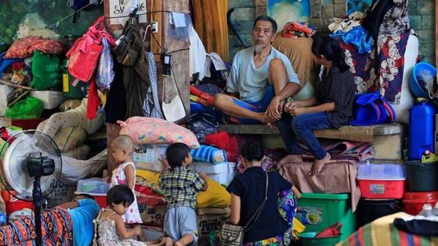 Residents who left their homes  are seen inside the evacuation centre in Iligan city, southern Philippines.  (REUTERS) 