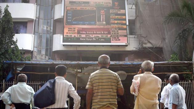 Investors watch the stock prices on a the display screen installed at Bombay Stock Exchange.(PTI) Investors watch the stock prices on a the display screen installed at Bombay Stock Exchange.(PTI)