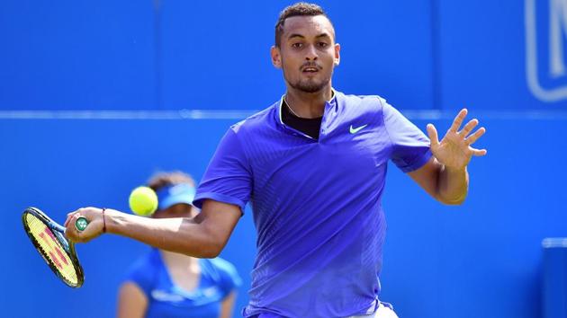Australia's Nick Kyrgios returns to Donald Young in their men's singles 1st round match at the Queen’s Club Championships. (AFP) Australia's Nick Kyrgios returns to Donald Young in their men's singles 1st round match at the Queen’s Club Championships. (AFP)