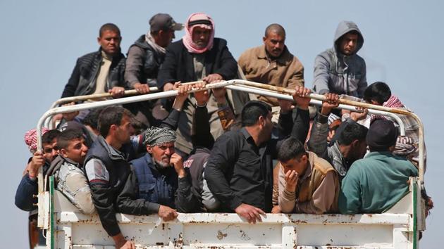 Displaced Iraqis, who fled their homes in the Old City in western Mosul due to the ongoing fighting between government forces and Islamic State (IS) group fighters, are taken to the Hammam al-Alil camp, south of Mosul, on March 27, 2017. Iraqi forces renewed their assault against jihadists in Mosul's Old City, after days in which the battle was overshadowed by reports of heavy civilian casualties from air strikes. (AFP) Displaced Iraqis, who fled their homes in the Old City in western Mosul due to the ongoing fighting between government forces and Islamic State (IS) group fighters, are taken to the Hammam al-Alil camp, south of Mosul, on March 27, 2017. Iraqi forces renewed their assault against jihadists in Mosul's Old City, after days in which the battle was overshadowed by reports of heavy civilian casualties from air strikes. (AFP)