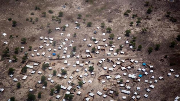 Aerial view of the new settlement of displaced families in Aburoc, South Sudan on June 5, 2017. Government offensives on the West Bank of the Nile river in April and May 2017 led to the capture of several villages, including Kodok. Up to 25,000 people were displaced during these clashes, most of whom initially fled toward Aburoc. In subsequent weeks, at least 20,000 people fled to Sudan. Many of those in Aburoc walked for days on foot to reach the location without access to sufficient water due to conflict along the River Nile and arrived exhausted and weak. (AFP) Aerial view of the new settlement of displaced families in Aburoc, South Sudan on June 5, 2017. Government offensives on the West Bank of the Nile river in April and May 2017 led to the capture of several villages, including Kodok. Up to 25,000 people were displaced during these clashes, most of whom initially fled toward Aburoc. In subsequent weeks, at least 20,000 people fled to Sudan. Many of those in Aburoc walked for days on foot to reach the location without access to sufficient water due to conflict along the River Nile and arrived exhausted and weak. (AFP)