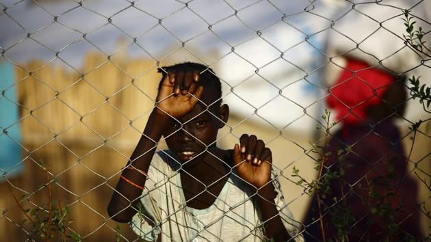 A South Sudanese refugee child stands at the UNHCR camp of al-Algaya in Sudan's White Nile state, south of Khartoum, on May 17, 2017. More than 95,000 South Sudanese have entered Sudan so far this year, the UN said, as thousands continue to flee war and famine in the world's youngest nation. South Sudan, which split from the north in 2011, has declared famine in parts of the country, saying a million people are on the brink of starvation. (AFP) A South Sudanese refugee child stands at the UNHCR camp of al-Algaya in Sudan's White Nile state, south of Khartoum, on May 17, 2017. More than 95,000 South Sudanese have entered Sudan so far this year, the UN said, as thousands continue to flee war and famine in the world's youngest nation. South Sudan, which split from the north in 2011, has declared famine in parts of the country, saying a million people are on the brink of starvation. (AFP)