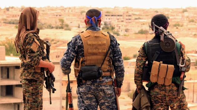This April 30, 2017, file photo provided by the Syrian Democratic Forces (SDF) shows fighters from the SDF looking toward the northern town of Tabqa, Syria. The U.S.-led coalition headquarters in Iraq said in a written statement that a U.S. F-18 Super Hornet shot down a Syrian government SU-22 on Sunday, June 18, after it dropped bombs near the U.S. partner forces, known as the Syrian Democratic Forces. The shootdown was near the Syrian town of Tabqa. (AP) This April 30, 2017, file photo provided by the Syrian Democratic Forces (SDF) shows fighters from the SDF looking toward the northern town of Tabqa, Syria. The U.S.-led coalition headquarters in Iraq said in a written statement that a U.S. F-18 Super Hornet shot down a Syrian government SU-22 on Sunday, June 18, after it dropped bombs near the U.S. partner forces, known as the Syrian Democratic Forces. The shootdown was near the Syrian town of Tabqa. (AP)