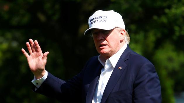 US President Donald Trump walks to the White House in Washington, following his arrival from Camp David, June 18, 2017.(REUTERS)