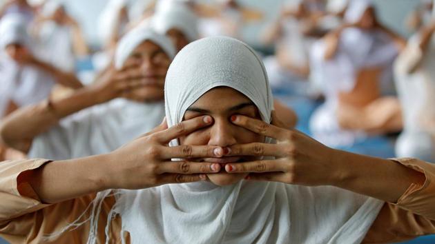 Girls attend a yoga lesson at a school ahead of International Yoga Day in Ahmedabad, Gujarat on June 15, 2017. (Amit Dave/REUTERS) Girls attend a yoga lesson at a school ahead of International Yoga Day in Ahmedabad, Gujarat on June 15, 2017. (Amit Dave/REUTERS)