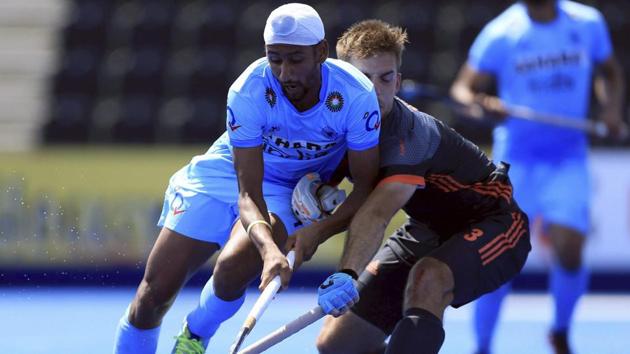 India's Mandeep Singh, left, and Netherlands Tristan Algera battle for the ball during the FIH Hockey World League. (AP) India's Mandeep Singh, left, and Netherlands Tristan Algera battle for the ball during the FIH Hockey World League. (AP)