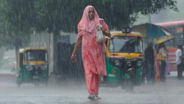 An elderly woman walks during heavy rains on June 2 New Delhi. The capital received 26.4mm of rain in the past 24 hours, the highest single day downpour observed in June since 2013. The MeT office has said more rain is expected in the coming days as Western disturbances hit the city. This welcome respite from the heat of past weeks also brought with it longer commutes for motorists in the morning and waterlogging at several locations across the city. (Burhaan Kinu/HT Photo) An elderly woman walks during heavy rains on June 2 New Delhi. The capital received 26.4mm of rain in the past 24 hours, the highest single day downpour observed in June since 2013. The MeT office has said more rain is expected in the coming days as Western disturbances hit the city. This welcome respite from the heat of past weeks also brought with it longer commutes for motorists in the morning and waterlogging at several locations across the city. (Burhaan Kinu/HT Photo)