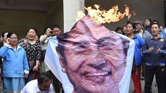 GJM supporters in Darjeeling burn an effigy of West Bengal Chief Minister Mamata Banerjee on Monday. (PTI) GJM supporters in Darjeeling burn an effigy of West Bengal Chief Minister Mamata Banerjee on Monday. (PTI)