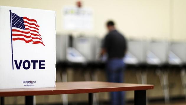 A voter casts his ballot in Georgia's 6th Congressional District special election at a polling site in Sandy Springs on June 20, 2017. The most expensive House race in US history will see either Republican Karen Handel claim a seat that's been in her party's hands since 1979, or Democrat Jon Ossoff manage an upset that will rattle Washington ahead of the 2018 midterm elections. (AP) A voter casts his ballot in Georgia's 6th Congressional District special election at a polling site in Sandy Springs on June 20, 2017. The most expensive House race in US history will see either Republican Karen Handel claim a seat that's been in her party's hands since 1979, or Democrat Jon Ossoff manage an upset that will rattle Washington ahead of the 2018 midterm elections. (AP)