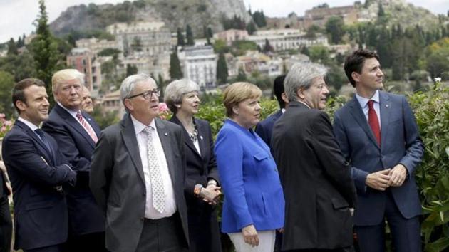 French President Emmanuel Macron, U.S. President Donald Trump, EU Commission President Jean-Claude Juncker, British Prime Minister Theresa May, German Chancellor Angela Merkel, Italian Prime Minister Paolo Gentiloni and Canadian Prime Minister Justin Trudeau at a G7 meeting(AP)