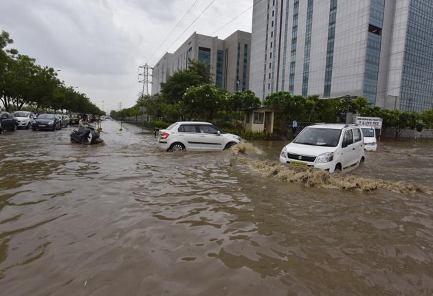 Waterlogging was a common sight at several spots in Gurgaon after the heavy downpour in Delhi- NCR on Monday morning. (Sanjeev Verma/HT) Waterlogging was a common sight at several spots in Gurgaon after the heavy downpour in Delhi- NCR on Monday morning. (Sanjeev Verma/HT)