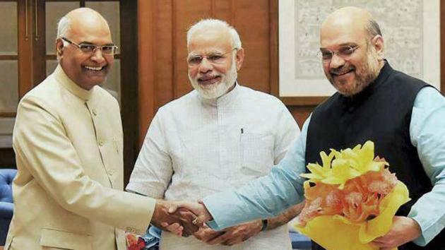 Prime Minister Narenda Modi and BJP chief Amit Shah with NDA's presidential nominee and Bihar Governor Ram Nath Kovind in New Delhi on June 19, 2017. (PTI) Prime Minister Narenda Modi and BJP chief Amit Shah with NDA's presidential nominee and Bihar Governor Ram Nath Kovind in New Delhi on June 19, 2017. (PTI)