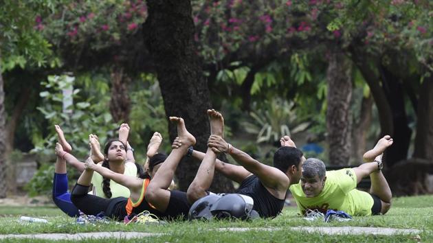 A group strikes a yoga pose at Lodhi Garden in New Delhi on June 18, 2017. (Arvind Yadav/HT Photo) A group strikes a yoga pose at Lodhi Garden in New Delhi on June 18, 2017. (Arvind Yadav/HT Photo)