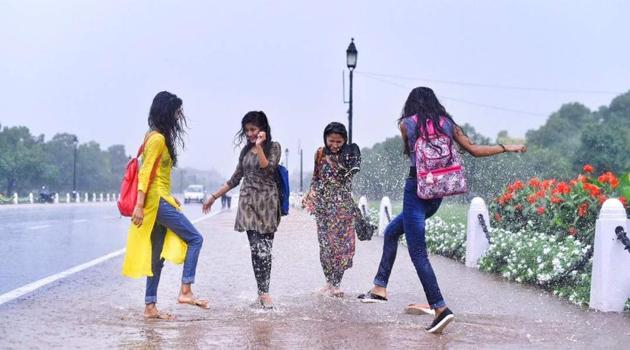 Students enjoy the rain showers near India Gate on Wednesday. Though overnight showers came to a halt in the morning, the rain resumed again in the afternoon giving Delhiites a pleasant surprise. (Arun Sharma / HT Photo) Students enjoy the rain showers near India Gate on Wednesday. Though overnight showers came to a halt in the morning, the rain resumed again in the afternoon giving Delhiites a pleasant surprise. (Arun Sharma / HT Photo)