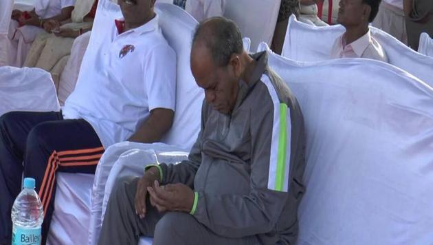 SLEEP THERAPY? Madhya Pradesh agriculture minister Gaurishankar Bisen catches forty winks during the International Yoga Day function in Chhindwara on Wednesday.(HT Photo)