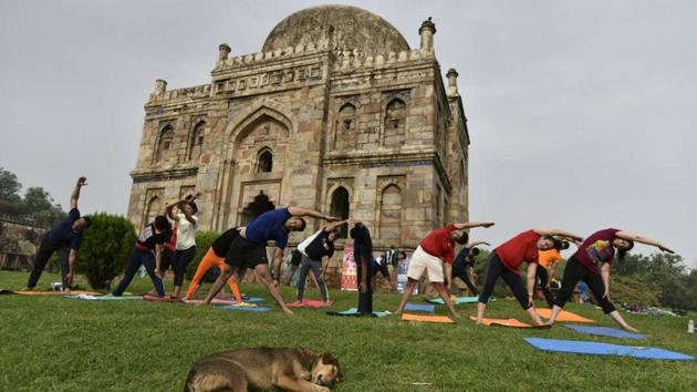 People perform yoga on International Yoga Day at Lodhi garden in New Delhi. (Arvind Yadav/HT Photo) People perform yoga on International Yoga Day at Lodhi garden in New Delhi. (Arvind Yadav/HT Photo)