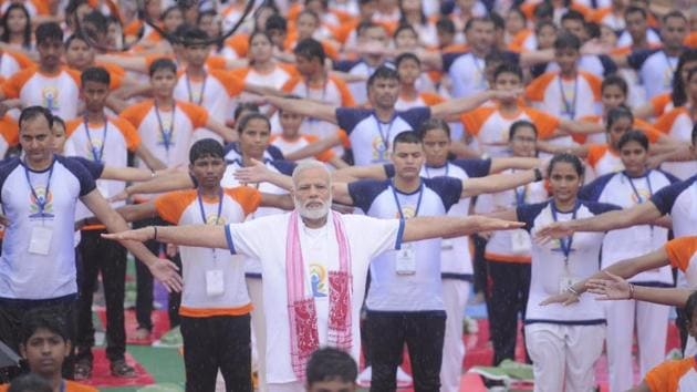 Prime Minister Narendra Modi takes part in a yoga session at Ramabai Ambedkar ground in Lucknow, Uttar Pradesh. (Subhankar Chakraborty/HT Photo) Prime Minister Narendra Modi takes part in a yoga session at Ramabai Ambedkar ground in Lucknow, Uttar Pradesh. (Subhankar Chakraborty/HT Photo)