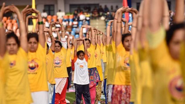 A collective Yoga session seen underway Kanteerava stadium on International Yoga Day in Bengaluru, Karnataka. (ARIJIT SEN/HT Photo) A collective Yoga session seen underway Kanteerava stadium on International Yoga Day in Bengaluru, Karnataka. (ARIJIT SEN/HT Photo)
