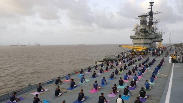 Indian Naval Cadets perform yoga on the deck of INS Virat on International Yoga Day in Mumbai, Maharashtra. Large scale yoga sessions have people across India bending and twisting into various poses on International Day of Yoga. Here’s a look in pictures. (Pratik Chorge/HT Photo) Indian Naval Cadets perform yoga on the deck of INS Virat on International Yoga Day in Mumbai, Maharashtra. Large scale yoga sessions have people across India bending and twisting into various poses on International Day of Yoga. Here’s a look in pictures. (Pratik Chorge/HT Photo)