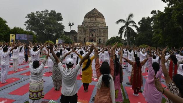 People take part in Yoga Day celebrations at Lodhi Gardens in New Delhi.(Arvind Yadav / HT Photo) People take part in Yoga Day celebrations at Lodhi Gardens in New Delhi.(Arvind Yadav / HT Photo)