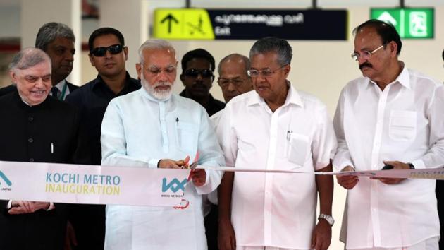 Prime Minister Narendra Modi inaugurating the Kochi Metro, on June 17. Kerala governor P. Sathasivam, the Union Minister for Urban Development, Housing and Urban Poverty Alleviation and Information and Broadcasting, M. Venkaiah Naidu and Kerala chief minister Pinarayi Vijayan are also seen.(PIB)