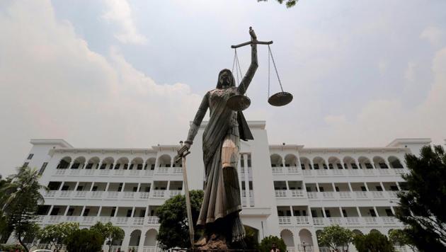 The statue of Lady Justice stands after it was reinstalled near the Supreme Court complex in Dhaka, Bangladesh, May 28(AP)