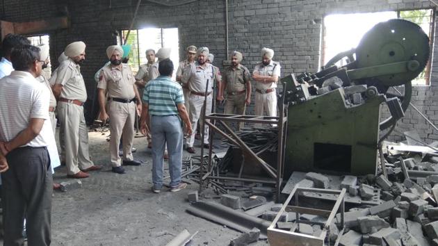Police officials at factory blast site in Fatehgarh Chhanna village of Barnala district on Wednesday(HT Photo)