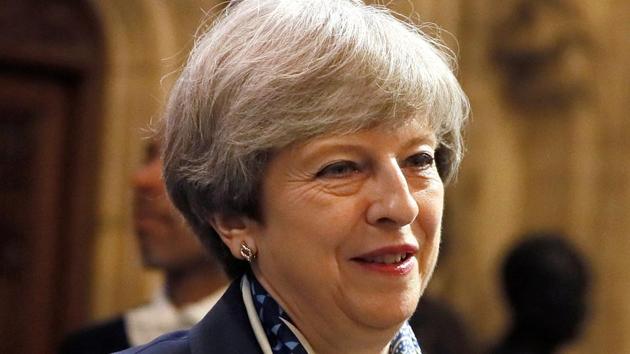 Britain's Prime Minister Theresa May walks through the Houses of Parliament during the state opening of Parliament in London on June 21, 2017. (Reuters) Britain's Prime Minister Theresa May walks through the Houses of Parliament during the state opening of Parliament in London on June 21, 2017. (Reuters)