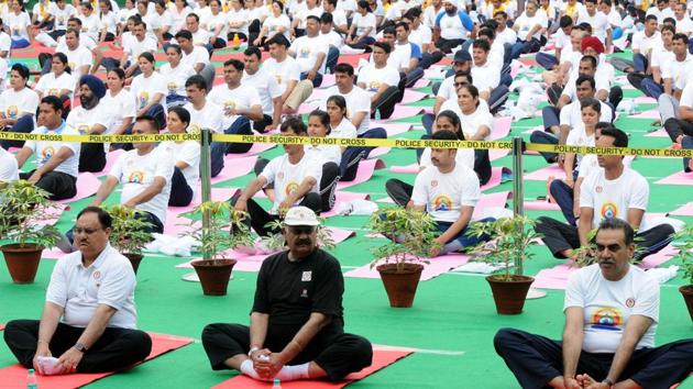 (From left) Union health minister JP Nadda , Punjab governor VP Singh Badnore and Chandigarh BJP chief Sanjay Tandon performing bhadrasana during a yoga session at the Sector 17 Plaza in Chandigarh. (Keshav Singh/HT) (From left) Union health minister JP Nadda , Punjab governor VP Singh Badnore and Chandigarh BJP chief Sanjay Tandon performing bhadrasana during a yoga session at the Sector 17 Plaza in Chandigarh. (Keshav Singh/HT)