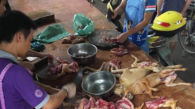 A vendor chops dog meat at the Nanqiao market in Yulin. Despite the fact that there does not seem to be a ban on dog meat authorities claim that the festival appears to be smaller this year with fewer dogs losing their lives. (AFP) A vendor chops dog meat at the Nanqiao market in Yulin. Despite the fact that there does not seem to be a ban on dog meat authorities claim that the festival appears to be smaller this year with fewer dogs losing their lives. (AFP)