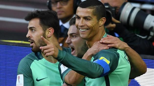 Cristiano Ronaldo (R) celebrates after scoring a goal during the FIFA Confederations Cup match between Russia and Portugal. (AFP) Cristiano Ronaldo (R) celebrates after scoring a goal during the FIFA Confederations Cup match between Russia and Portugal. (AFP)