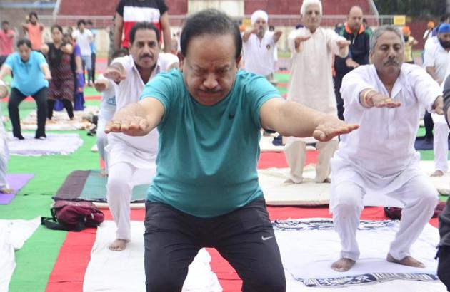 Union science and technology minister Dr Harsh Vardhan doing the Kursi Asana at Guru Nanak Stadium in Amritsar. (Sameer Sehgal/HT) Union science and technology minister Dr Harsh Vardhan doing the Kursi Asana at Guru Nanak Stadium in Amritsar. (Sameer Sehgal/HT)