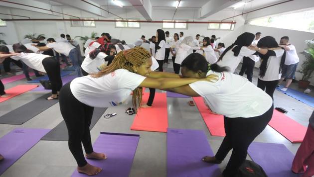 Foreign students from Symbiosis International University perform yoga on the occasion of International Yoga Day in Pune. (HT PHOTO) Foreign students from Symbiosis International University perform yoga on the occasion of International Yoga Day in Pune. (HT PHOTO)