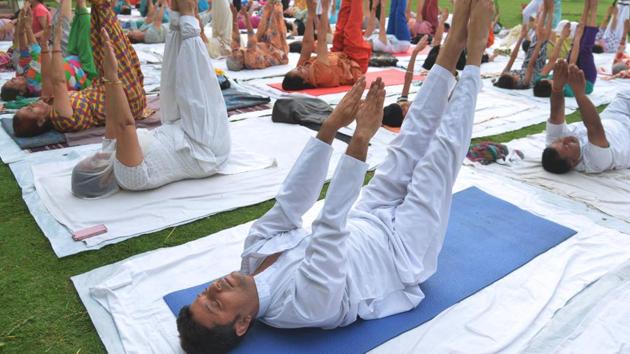 Yoga practitioners participate in a session at a park in Amritsar on June 20. (AFP Photo) Yoga practitioners participate in a session at a park in Amritsar on June 20. (AFP Photo)