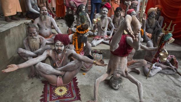 Indian Sadhus or Hindu holy men perform yoga on International Yoga Day at Kamakhya temple in Assam. (Anupam Nath/AP) Indian Sadhus or Hindu holy men perform yoga on International Yoga Day at Kamakhya temple in Assam. (Anupam Nath/AP)