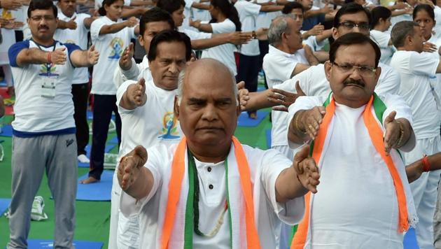 NDA candidate for President of India Ram Nath Kovind participates in a yoga session, to mark the 3rd International Yoga Day 2017, in Connaught Place area of New Delhi on Wednesday. (PTI) NDA candidate for President of India Ram Nath Kovind participates in a yoga session, to mark the 3rd International Yoga Day 2017, in Connaught Place area of New Delhi on Wednesday. (PTI)