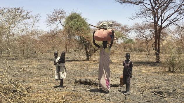 A displaced family carrying their belongings walks in search of refuge towards the village of Aburoc, South Sudan. A report by Amnesty International says South Sudanese forces burned, shelled and ransacked homes killing civilians and forcing thousands from the Shilluk ethnic minority to flee. (AP) A displaced family carrying their belongings walks in search of refuge towards the village of Aburoc, South Sudan. A report by Amnesty International says South Sudanese forces burned, shelled and ransacked homes killing civilians and forcing thousands from the Shilluk ethnic minority to flee. (AP)