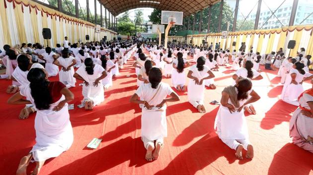 Participants seen mid-pose at an International Yoga Day event inaugurated by Kerala chief minister Pinarayi Vijayan at Central stadium in Thiruvananthapuram, Kerala. (Vivek R Nair/HT Photo) Participants seen mid-pose at an International Yoga Day event inaugurated by Kerala chief minister Pinarayi Vijayan at Central stadium in Thiruvananthapuram, Kerala. (Vivek R Nair/HT Photo)