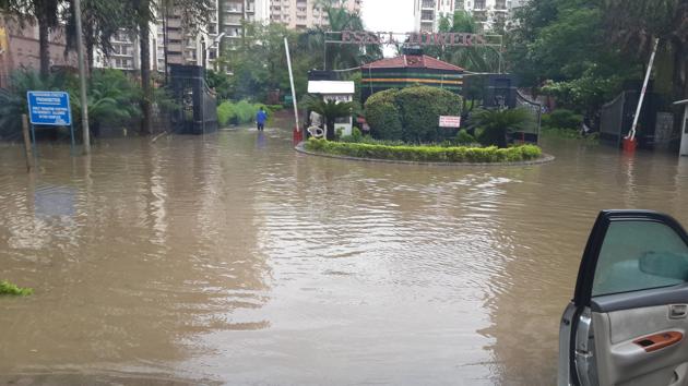 Due to waterlogging, the residents are forced to park their vehicles on the service lane or MG Road.(HT PHOTO)