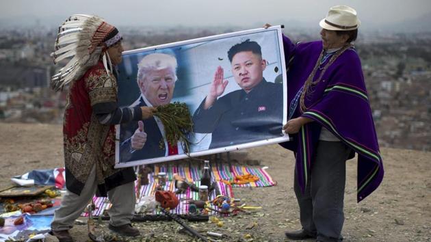 Shamans hold posters of US President Donald Trump, left, and North Korean leader Kim Jong, perform a ceremony on Morro Solar in Lima, Peru, June 12. The shamans said they performed the ritual for peace between the US and North Korea. (AP File Photo) Shamans hold posters of US President Donald Trump, left, and North Korean leader Kim Jong, perform a ceremony on Morro Solar in Lima, Peru, June 12. The shamans said they performed the ritual for peace between the US and North Korea. (AP File Photo)